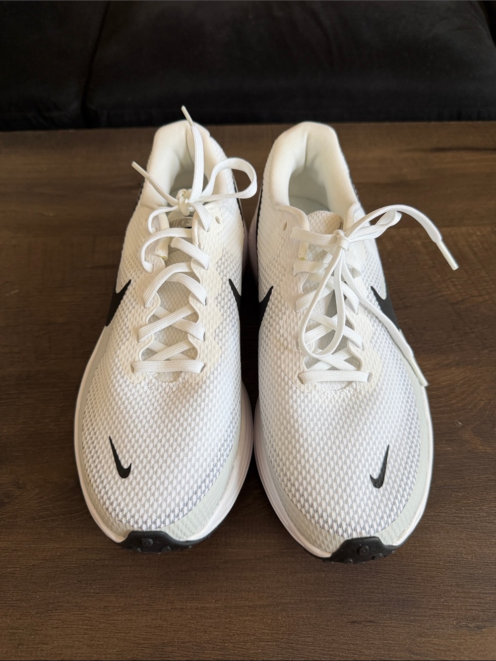 Nike Men's White Athletic Running Shoes with Black Swoosh